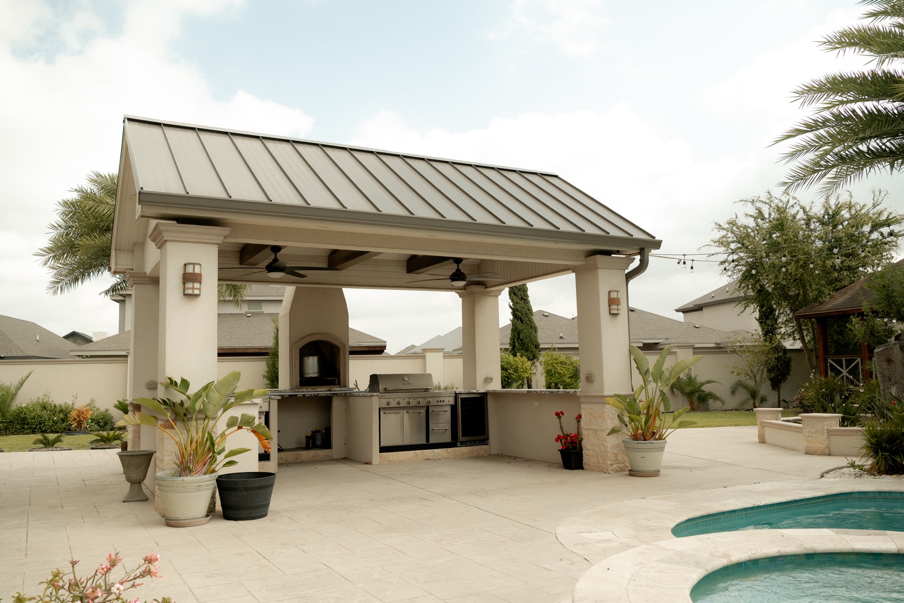Covered outdoor kitchen and grill pavilion