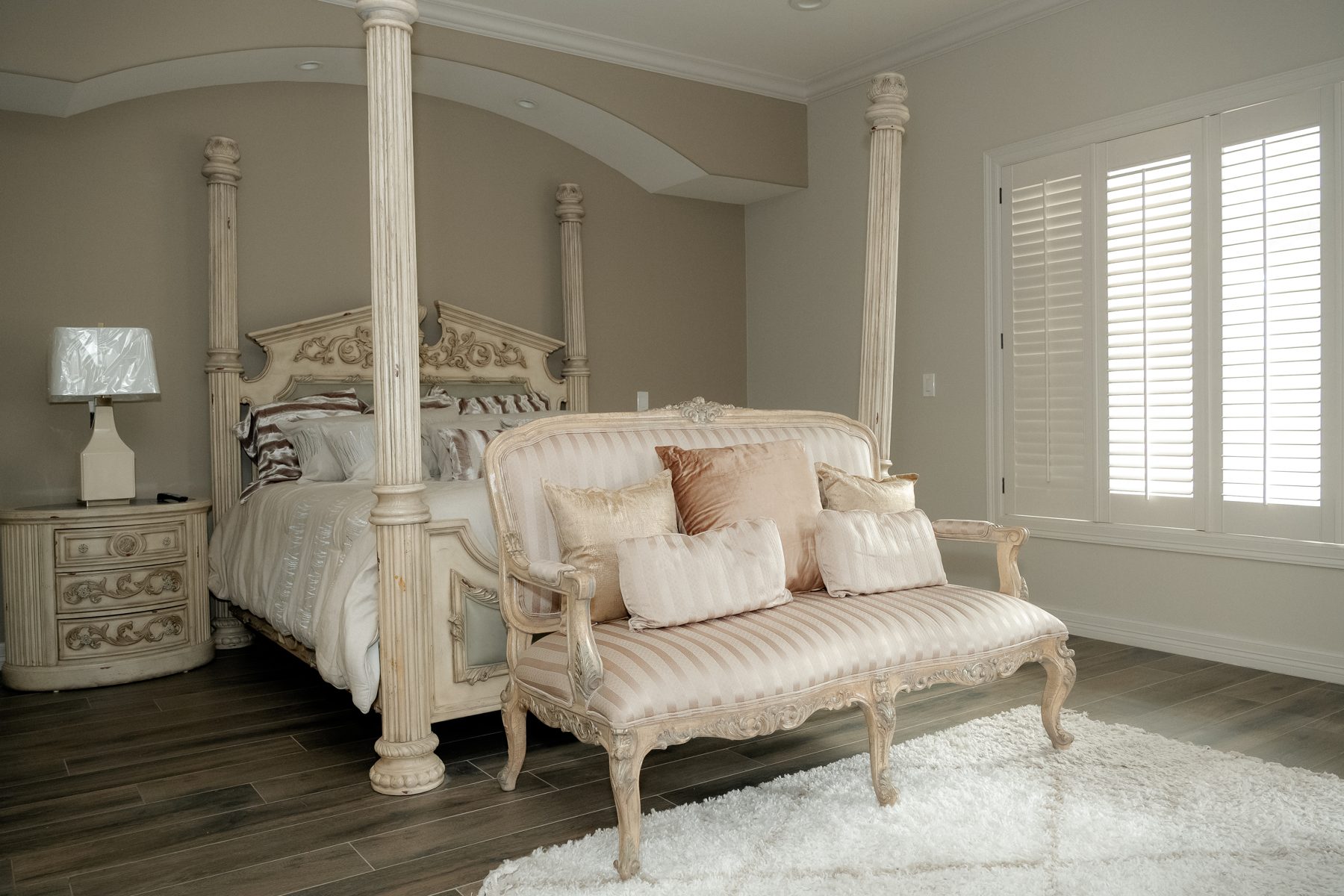 Ornate master bedroom with four-poster bed