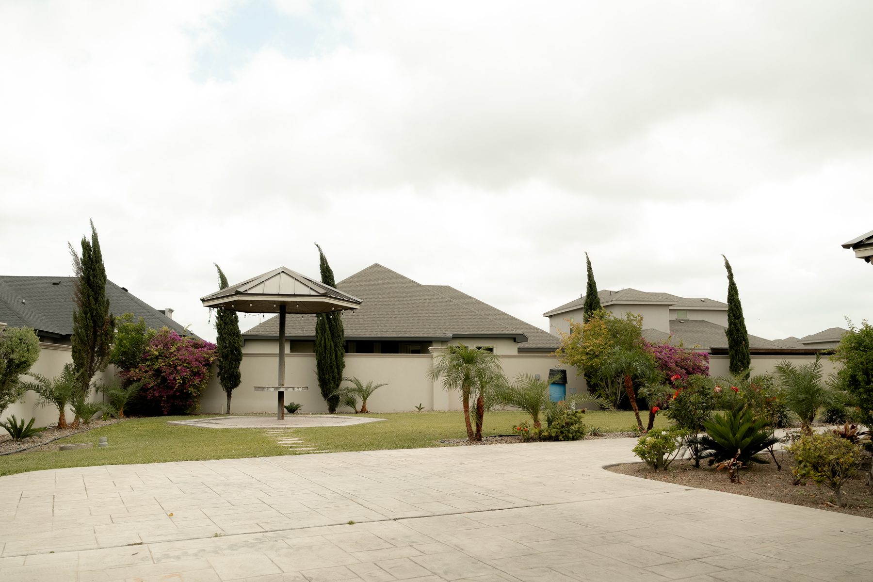 Casa Paraíso full compound with gazebo, cypress trees, and event lawn
